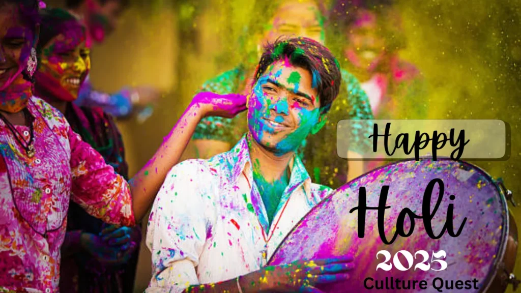 A vibrant scene of Holi celebrations with people joyfully covered in colorful powders. A man, smiling and holding a drum, is surrounded by others enjoying the festival of colors. Bright hues of pink, yellow, green, and blue fill the air, symbolizing the spirit of togetherness and festivity