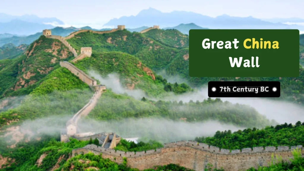 A breathtaking view of the Great Wall of China winding through green mountains, partially covered in mist, showcasing its historical and architectural grandeur.